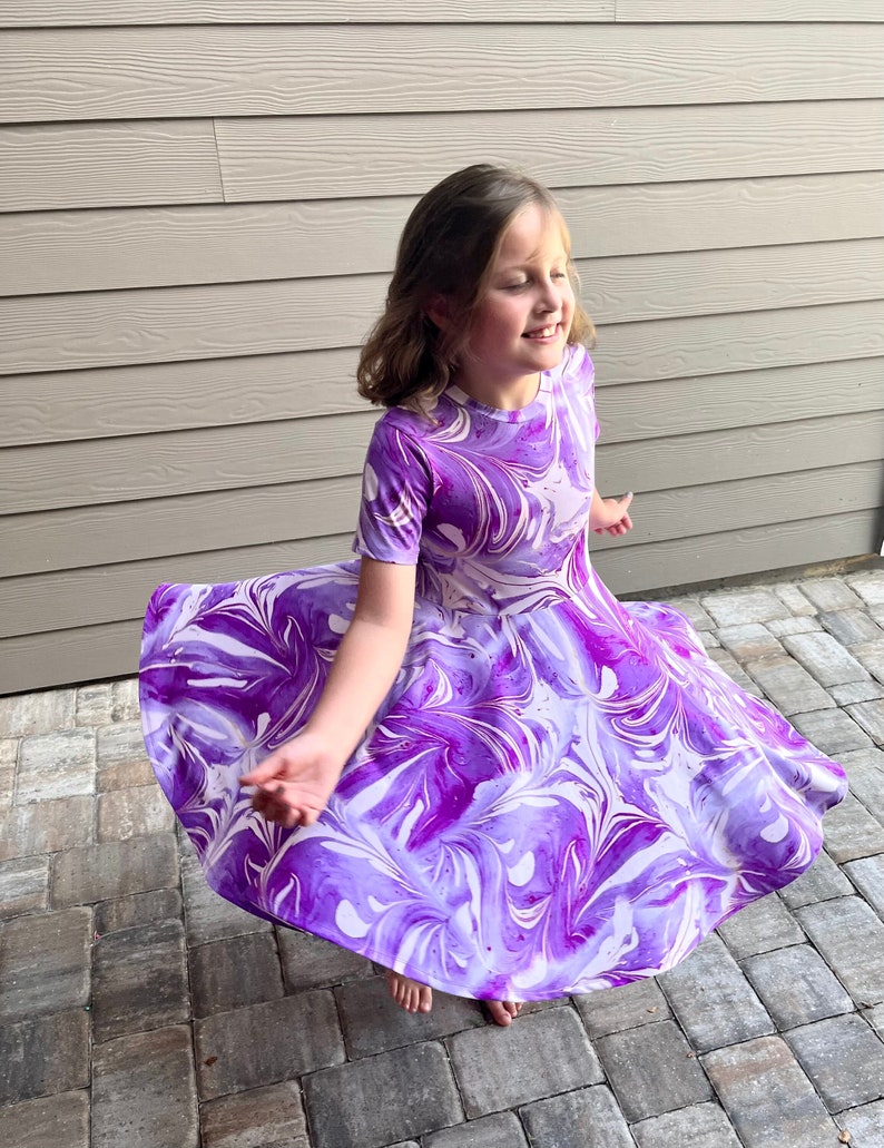 Twirly dress for girls in marble lavender print. Very sisters and comfortable.