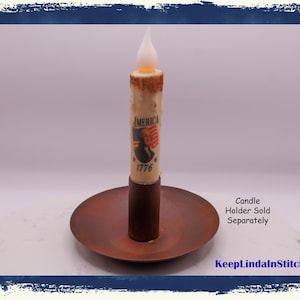 May include: A white ceramic mug with a black handle and the text "But First, Coffee" in a black, bold font. The mug is on a white surface. The mug is approximately 4 inches tall.