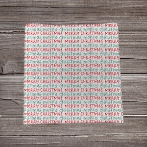 May include: A square, off-white fabric with a repeating pattern of the words "MERRY CHRISTMAS" in red and teal script. The words are layered and overlapping, creating a festive holiday design.
