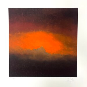 May include: A painting depicting a sunset with a large, orange cloud in the centre. The sky is a deep red and orange, and the clouds are a dark grey. The painting is signed in the bottom right corner.