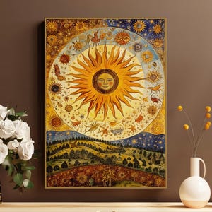 May include: A vintage-style illustration of a sun with a human face surrounded by stars and celestial bodies. The sun is yellow and orange with a golden halo. The background is a blue sky with white stars. The image is framed in a gold frame.