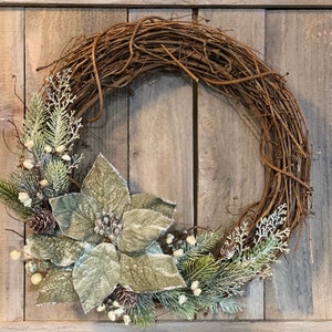 Sage green, velvet Poinsettia Christmas wreath, pine, pine cones, cedar, iced white berries, on grapevine.