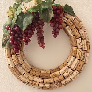 Wine Cork Wreath with Grape varieties, 16” diameter, attached metal D-ring hanger.