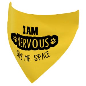 May include: Yellow dog bandana with black paw prints and the text "I AM NERVOUS GIVE ME SPACE".