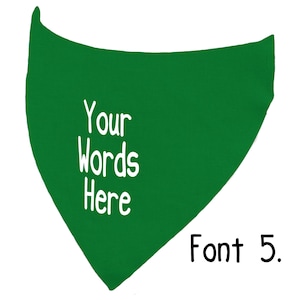 May include: A green bandana with the text "Your Words Here" in white, along with "Font 5." in black. The bandana is triangular in shape and likely designed for pets or as a fashion accessory.