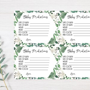 May include: Four printable baby shower game cards with a green and white floral design. The cards have lines for guests to write down their predictions for the baby's birth date, time, weight, height, eye color, and hair color. The text "Baby Predictions" is at the top of each card.