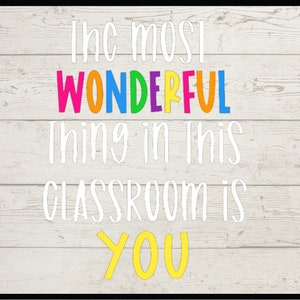 May include: White wooden sign with the text "The most WONDERFUL thing in this CLASSROOM is YOU" in colorful and white letters.