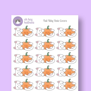 May include: Sheet of stickers featuring white cartoon cats with orange pumpkins. Each pumpkin has a day of the week printed on it. The text "oh hey katbuns" and "Fall Kitty Date Covers" are also visible.