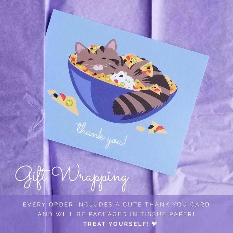 May include: A blue thank you card with a cartoon cat sleeping in a bowl of nachos. The card says "thank you!" and "Gift Wrapping" in a handwritten font. The text below the image says "Every order includes a cute thank you card and will be packaged in tissue paper! Treat yourself!"