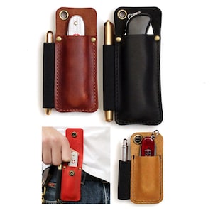 May include: Leather pocket organizers in brown, black, red, and tan. Each organizer holds a pen and a multi-tool knife. The organizers have a brass rivet and a black elastic band. One image shows the organizer attached to a belt.