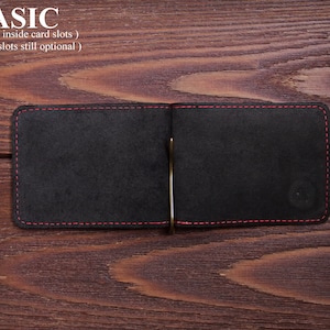 May include: A black leather wallet with red stitching detail and a metal money clip. The wallet is open and the inside is empty. The text "BASIC (without inside card slots) (outside slots still optional)" is above the wallet.