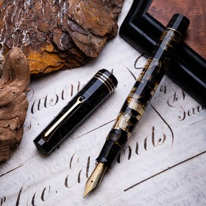 Omas - Extra Lucens Noir et or LE N.164/331 - Stylo plume