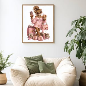 May include: A framed wall art print featuring a leopard character with a messy bun, wearing pink sunglasses, a pink sweatshirt with the word MESSY, and pink fuzzy slippers. The character holds a phone and a drink, surrounded by pink shopping bags and cash.