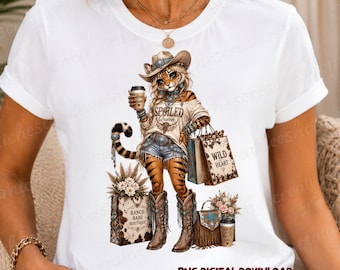 May include: A white t-shirt featuring a graphic of a tiger character wearing a cowboy hat, denim shorts, and boots. The tiger holds a coffee cup and shopping bags labeled "SPOILED QUEEN," "WILD HEART," and "RANCH BABE BOUTIQUE." The text "PNG DIGITAL DOWNLOAD" is at the bottom.