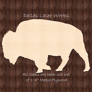 May include: A laser-cut wooden silhouette of a bison, made from 1/4 inch maple plywood. The text "Dallas Laser Works" is at the top of the image, and the text "All items are laser cut out of 1/4" Maple Plywood" is at the bottom.