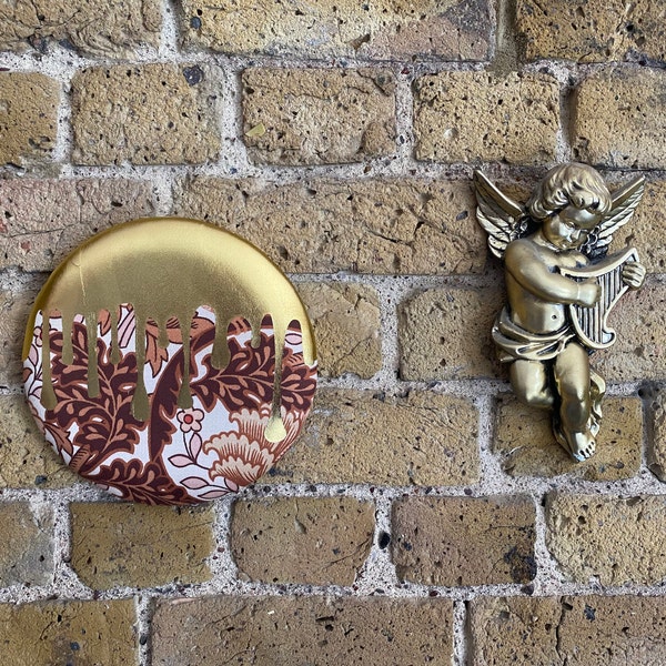 Metallic gold goop design on 70s style fabric wall hanging