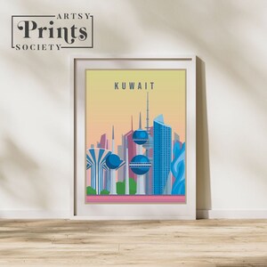May include: A colourful illustration of the Kuwait skyline, featuring several tall buildings with blue and white accents. The text "KUWAIT" is printed in white at the top of the image.