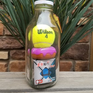 IMPOSSIBLE BOTTLE – Rubik’s Cube (in Sealed Package), Tennis Ball, Scissors
