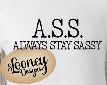 May include: White t-shirt with the text "A.S.S. ALWAYS STAY SASSY" and a brown oval with the text "Slooney Designs".
