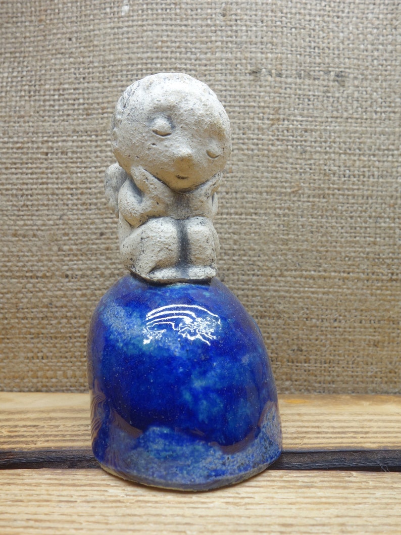 Ceramic figurine angel on a shell christmas angel