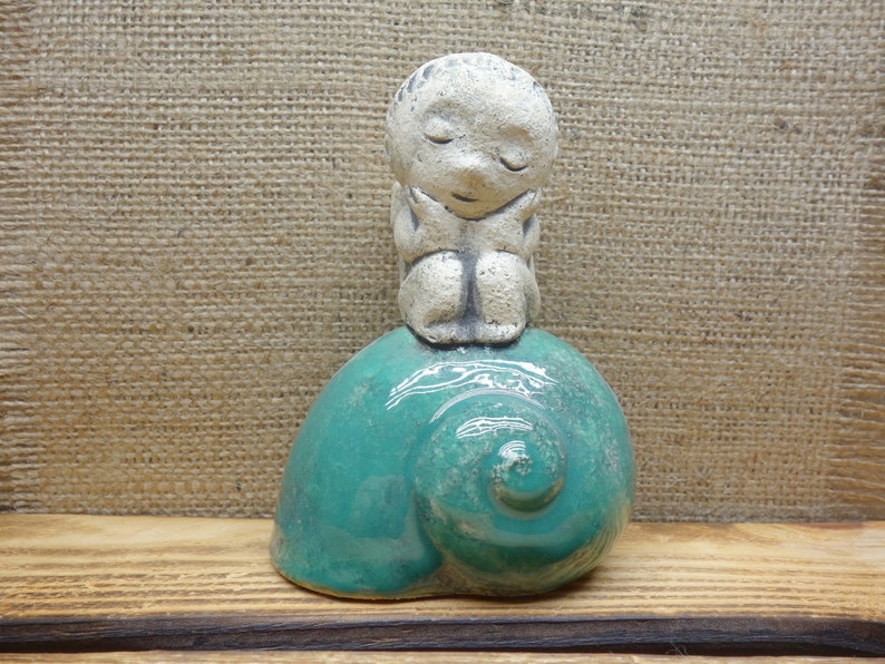 Ceramic figurine angel on a shell christmas angel