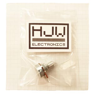 May include: A small electronic potentiometer component in a clear plastic bag. The component has a metal body, a rotating shaft, and three pins. The bag also contains a white label with the text "HJW ELECTRONICS". The background is a grid pattern.