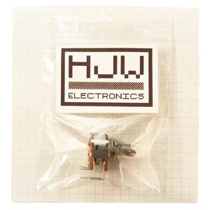 May include: A small electronic component, likely a potentiometer, is visible inside a clear plastic bag. The component has a metal body with brown and silver parts. A white label with the text "HJW ELECTRONICS" is above the component.