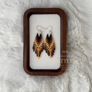 May include: A set of three ceramic mugs with a speckled, matte finish. The mugs are in shades of cream, light gray, and dark gray. Each mug has a simple, minimalist design, perfect for coffee or tea.