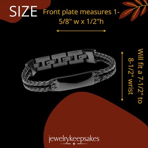 May include: Black leather bracelet with a black metal plate and a black metal clasp. The bracelet is 1-5/8 inches wide and 1/2 inch high. It will fit a 7-1/2 to 8-1/2 inch wrist.