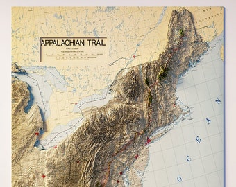 May include: A detailed relief map of the Appalachian Trail, showcasing the eastern United States. The map features topographic details, with text reading "Appalachian Trail" and a scale. The Atlantic Ocean is visible on the right side.