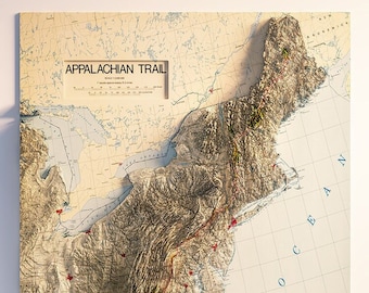 May include: A detailed map of the Appalachian Trail, a 2,190-mile hiking trail that runs from Georgia to Maine. The map shows the trail's route, elevation changes, and surrounding landmarks. The map is printed on a cream-colored background with a grid pattern.