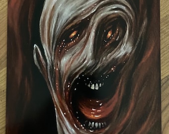 May include: A close-up of a horrifying, grotesque face with a mouth wide open, revealing sharp teeth and a red tongue. The face is covered in a white, slimy substance, and the eyes are glowing orange.