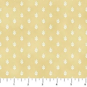 May include: A repeating pattern of white leaf-like shapes on a light yellow background. The leaves are evenly spaced and arranged in a grid-like formation. The fabric has a subtle, textured appearance.