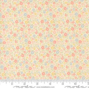 May include: A cream-colored fabric featuring a dense, repeating pattern of small flowers in shades of coral, light blue, and pale yellow, with green stems and leaves. A white ruler is visible at the bottom, showing a scale of 7 inches.