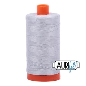 May include: A spool of silver gray thread with an orange plastic bobbin and the word "AURIfil" printed on the label.