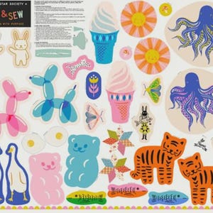May include: A Ruby Star Society Cut & Sew fabric panel featuring various printed motifs including blue and pink balloon animals, ice cream cones, octopuses, tigers, gummy bears, geese, fried eggs, suns, moths, and geometric star shapes.