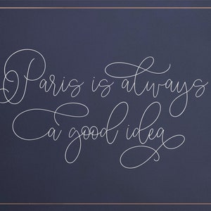 May include: A white cursive quote on a dark blue background that reads "Paris is always a good idea."