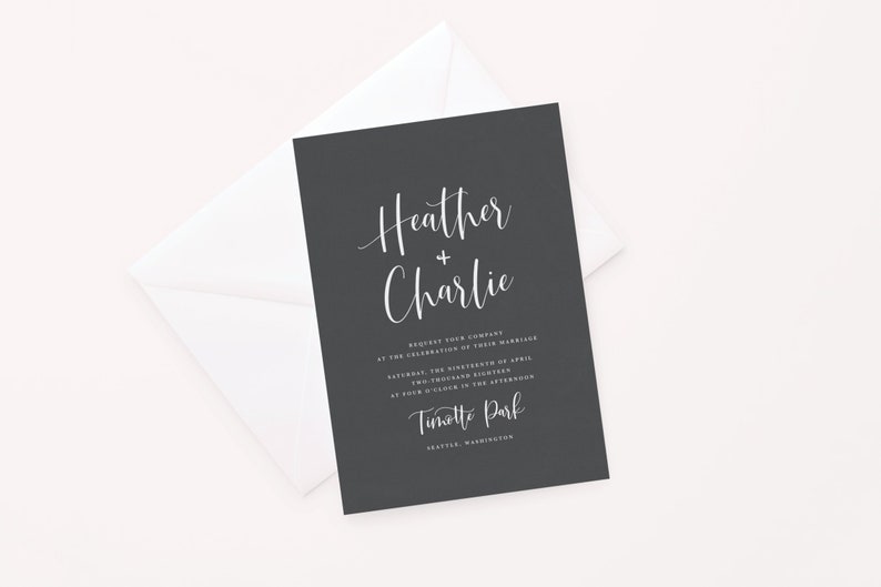 May include: Black wedding invitation with white text. The invitation reads "Heather + Charlie" and includes the date, time, and location of the wedding. The location is listed as "Tinott Park, Seattle, Washington."