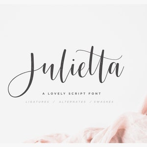 May include: A script font named "Julietta" in black text on a white background. The text reads "A Lovely Script Font" and "Ligatures / Alternates / Swashes". A pink fabric is in the bottom right corner of the image.