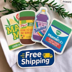 May include: A collection of five rectangular and die-cut stickers featuring colorful graphic designs. The stickers display text including Mama, 100% Amor, Eres una mam&aacute; Fabulosa, MamaRub, and Free Shipping with a yellow truck icon on a blue background.