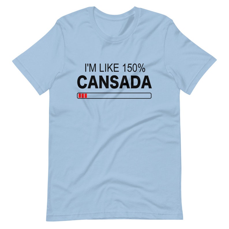 May include: Light blue t-shirt with black text that reads "I'm like 150% Cansada" with a red progress bar underneath.