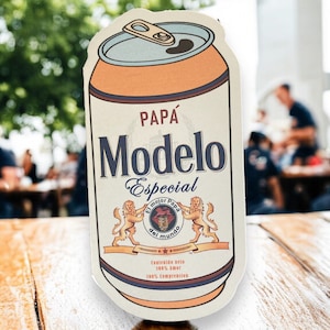 May include: A vintage-style illustration of a can of Modelo Especial beer. The can is yellow and white with a brown top and a red and white logo that says "Papa Modelo Especial El mejor Papa del mundo".