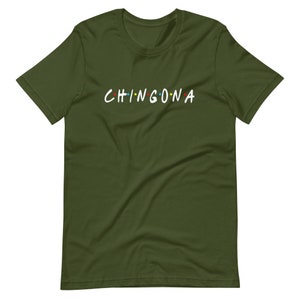 May include: A green t-shirt with the text "CHINGONA" in white letters with colorful dots.