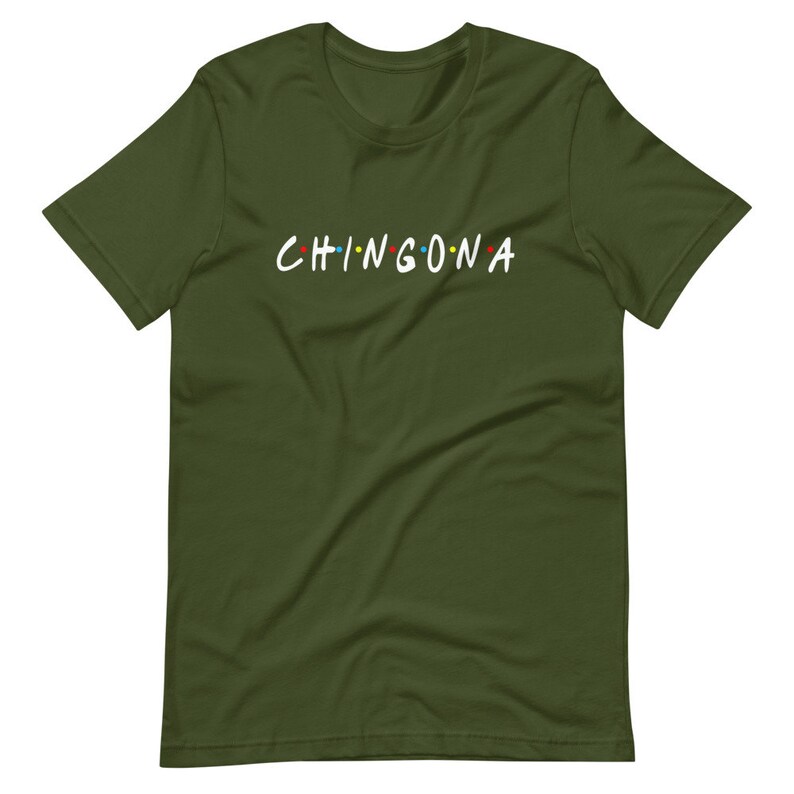 May include: A green t-shirt with the text "CHINGONA" in white letters with colorful dots.