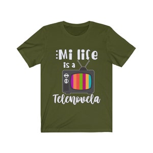 May include: A green t-shirt with a white graphic of a vintage television with the text "Mi life is a Telenovela".