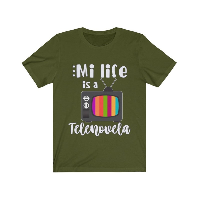May include: A green t-shirt with a white graphic of a vintage television with the text "Mi life is a Telenovela".