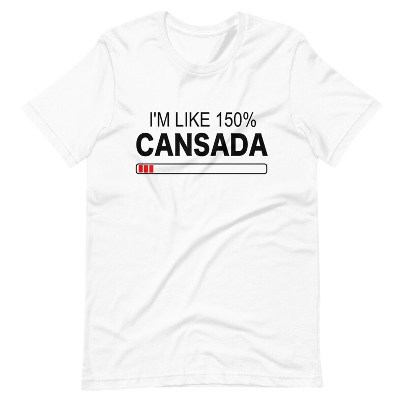 May include: White t-shirt with black text that reads "I'm like 150% Cansada" with a red progress bar underneath.