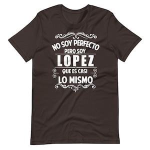 May include: A dark brown t-shirt with white text that reads "No soy perfecto pero soy Lopez que es casi lo mismo".