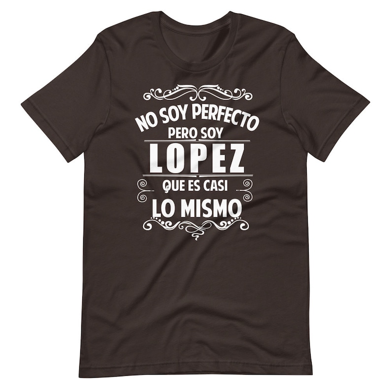 May include: A dark brown t-shirt with white text that reads "No soy perfecto pero soy Lopez que es casi lo mismo".