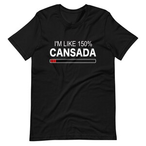 May include: Black t-shirt with white text that reads "I'm like 150% Cansada" with a progress bar underneath. The progress bar is filled with red.